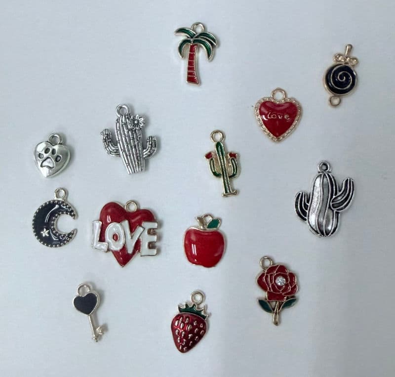 Permanent jewelry charm options at M-Power Salon & Spa